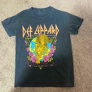 This is a preppy graphic band t-shirt for teens. The brand is The Vinyl Icons.